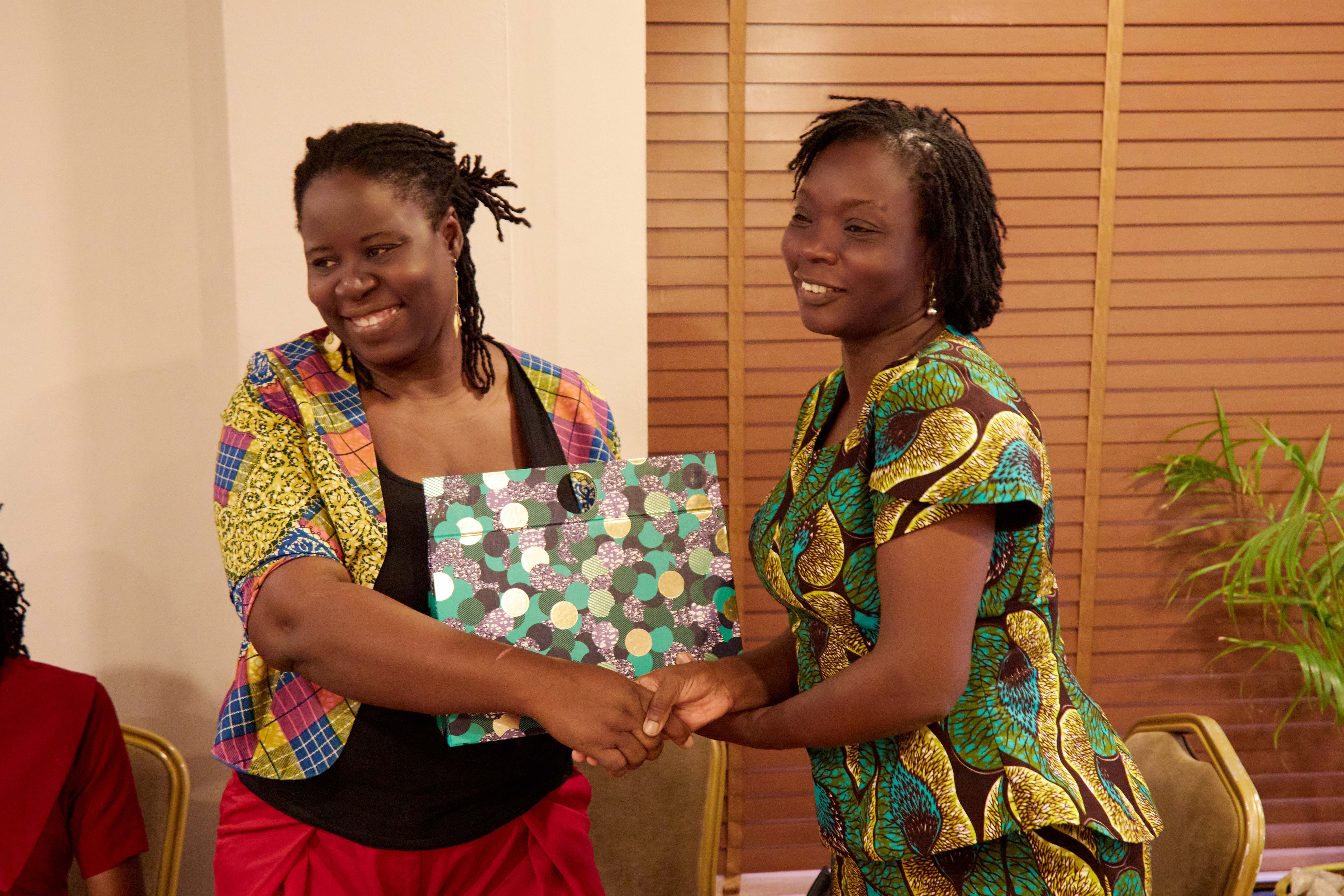 Outgoing Dean receiving plaque from incoming dean